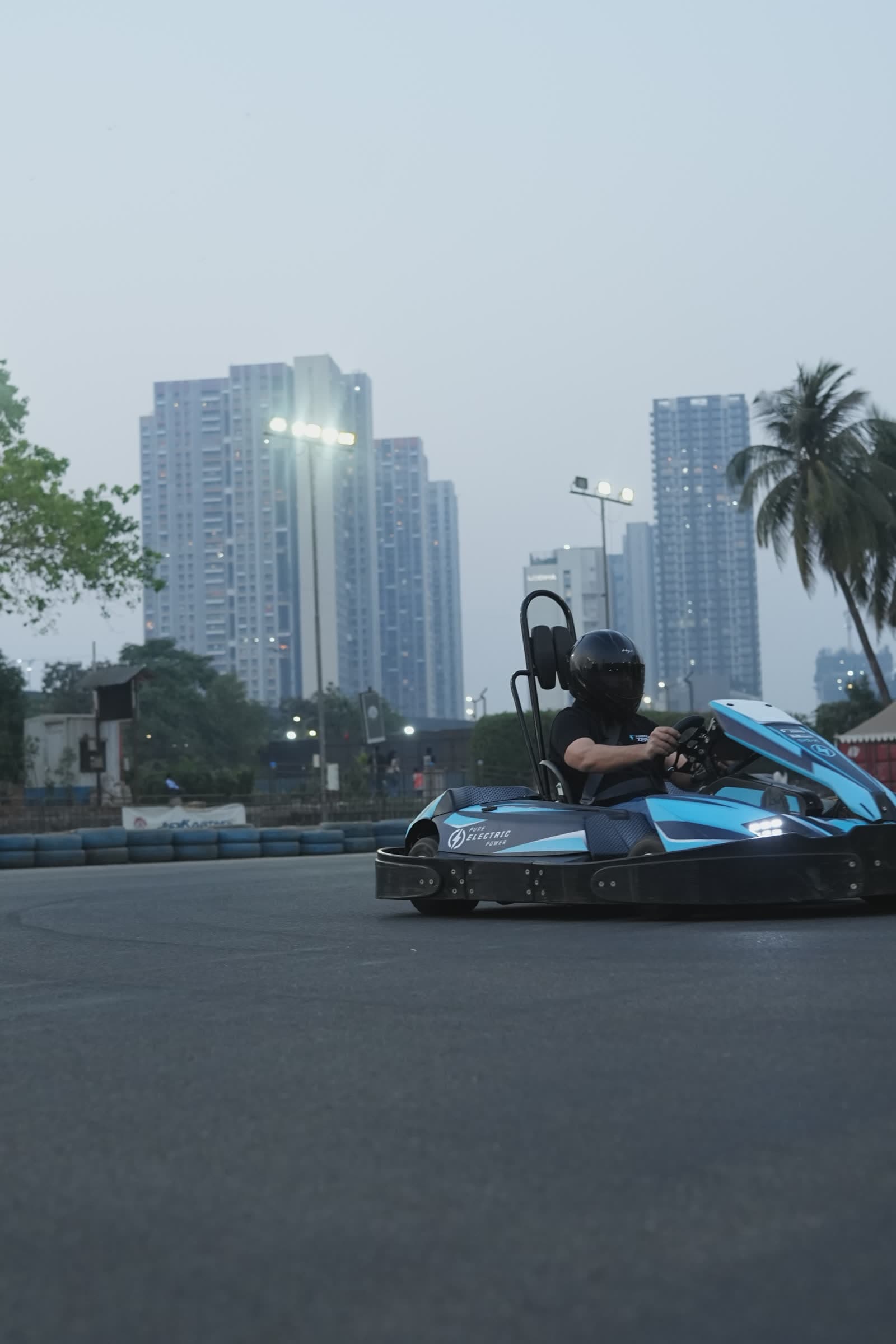 Go-kart track with city backdrop