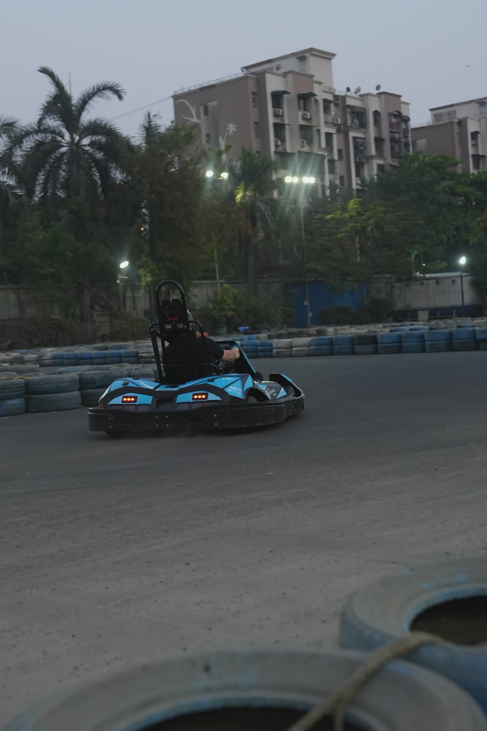 Electric go-karts racing at dusk